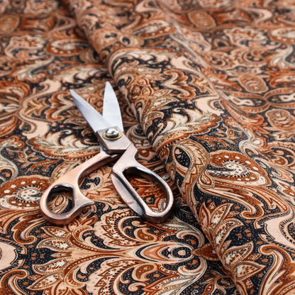 A dense, intricate, and ornate paisley and damask-style repeating pattern featuring rich earth tones of copper, brown, cream, and dark charcoal.