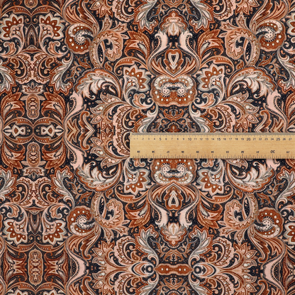 A dense, intricate, and ornate paisley and damask-style repeating pattern featuring rich earth tones of copper, brown, cream, and dark charcoal.