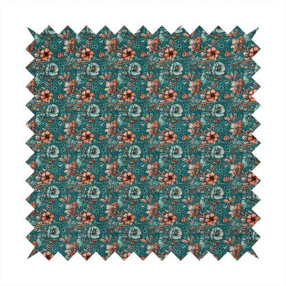 A dense, intricate, vintage-style botanical repeating pattern featuring small orange and pale grey-blue flowers with detailed foliage set against a dark teal background.