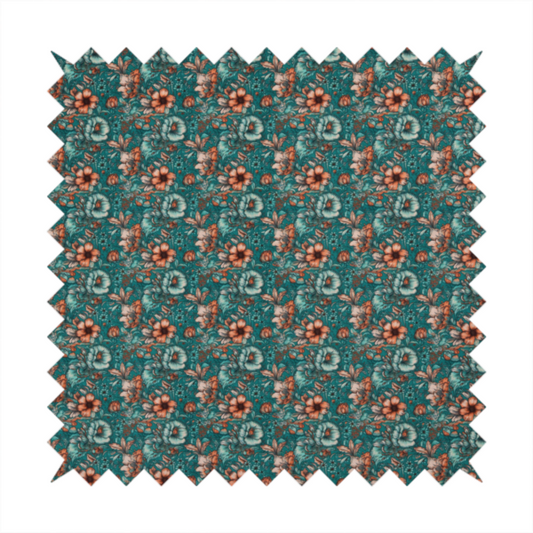 A dense, intricate, vintage-style botanical repeating pattern featuring small orange and pale grey-blue flowers with detailed foliage set against a dark teal background.