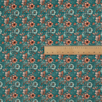 A dense, intricate, vintage-style botanical repeating pattern featuring small orange and pale grey-blue flowers with detailed foliage set against a dark teal background.