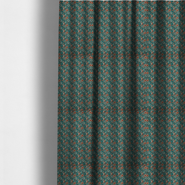 The fabric used to create these made-to-measure curtains is a dense, intricate, vintage-style botanical repeating pattern featuring small orange and pale grey-blue flowers with detailed foliage set against a dark teal background.