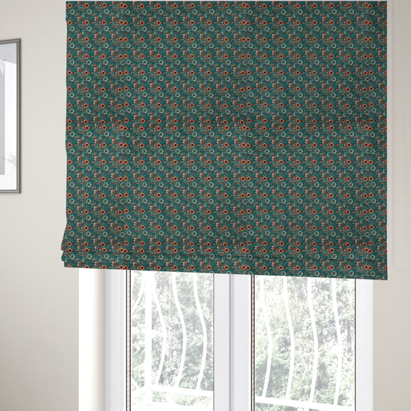 The fabric used to create these Roman blinds is a dense, intricate, vintage-style botanical repeating pattern featuring small orange and pale grey-blue flowers with detailed foliage set against a dark teal background.