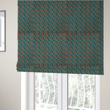 The fabric used to create these Roman blinds is a dense, intricate, vintage-style botanical repeating pattern featuring small orange and pale grey-blue flowers with detailed foliage set against a dark teal background.