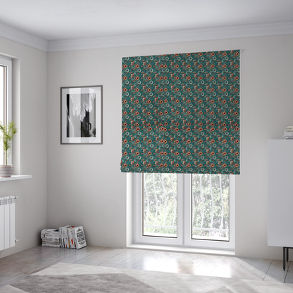 The fabric used to create these Roman blinds is a dense, intricate, vintage-style botanical repeating pattern featuring small orange and pale grey-blue flowers with detailed foliage set against a dark teal background.