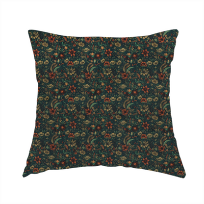 The fabric used to create this handmade cushion is a dense, dark, vintage-style botanical repeating pattern featuring small rust-red and pale yellow flowers interwoven with detailed dark green leaves and foliage against a deep dark background.