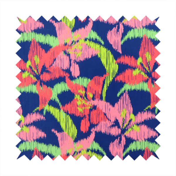 A vibrant fabric pattern featuring large coral and light pink lily flowers with bright lime green leaves against a solid royal blue background.
