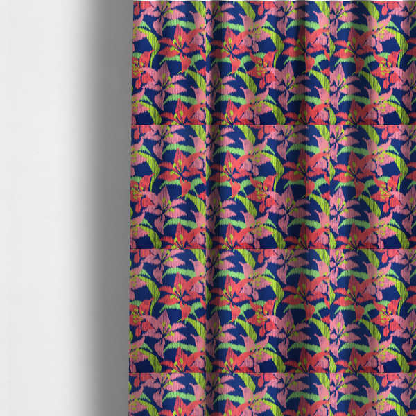 The fabric used to create these made-to-measure curtains is a vibrant fabric pattern featuring large coral and light pink lily flowers with bright lime green leaves against a solid royal blue background.