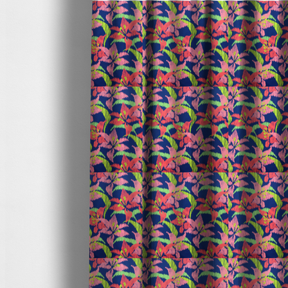 The fabric used to create these made-to-measure curtains is a vibrant fabric pattern featuring large coral and light pink lily flowers with bright lime green leaves against a solid royal blue background.