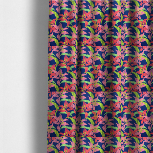 The fabric used to create these made-to-measure curtains is a vibrant fabric pattern featuring large coral and light pink lily flowers with bright lime green leaves against a solid royal blue background.