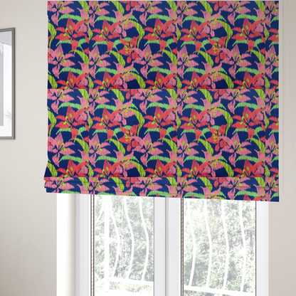 The fabric used to create these Roman blinds is a vibrant fabric pattern featuring large coral and light pink lily flowers with bright lime green leaves against a solid royal blue background.