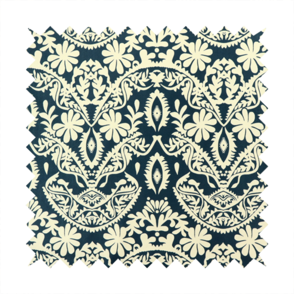 A dark midnight blue fabric featuring an ornate, repeating damask pattern in creamy off-white, composed of intricate scrollwork, floral motifs, and symmetrical ogee shapes.