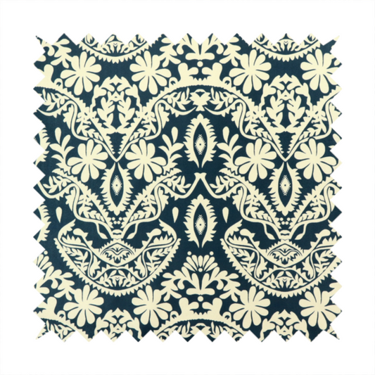 A dark midnight blue fabric featuring an ornate, repeating damask pattern in creamy off-white, composed of intricate scrollwork, floral motifs, and symmetrical ogee shapes.