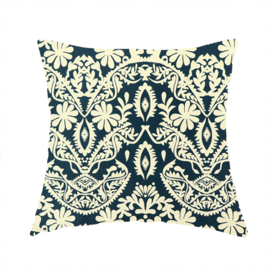 The fabric used to create this handmade cushion is a dark midnight blue fabric featuring an ornate, repeating damask pattern in creamy off-white, composed of intricate scrollwork, floral motifs, and symmetrical ogee shapes.