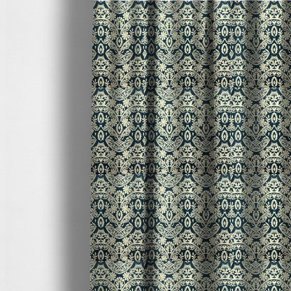 The fabric used to create these made-to-measure curtains is a dark midnight blue fabric featuring an ornate, repeating damask pattern in creamy off-white, composed of intricate scrollwork, floral motifs, and symmetrical ogee shapes.