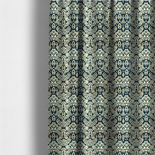 The fabric used to create these made-to-measure curtains is a dark midnight blue fabric featuring an ornate, repeating damask pattern in creamy off-white, composed of intricate scrollwork, floral motifs, and symmetrical ogee shapes.