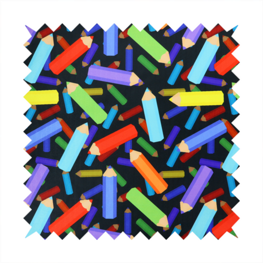 A black fabric featuring a playful, repeating pattern of coloured pencils in various shades including red, yellow, light blue, green, purple, and orange scattered diagonally across the background.
