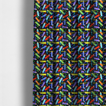 The fabric used to create these made-to-measure curtains is a black fabric featuring a playful, repeating pattern of coloured pencils in various shades including red, yellow, light blue, green, purple, and orange scattered diagonally across the background.