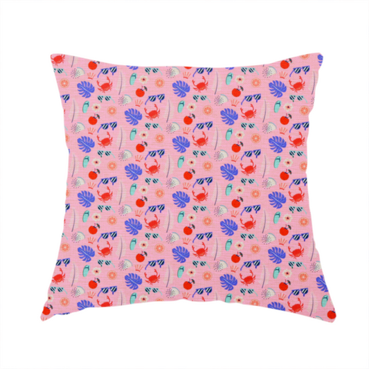 The fabric used to create this handmade cushion is a ink summer-themed fabric featuring a repeating pattern of tropical icons including crabs, sunglasses, cherries, flip-flops, palm leaves, citrus slices, and flowers.