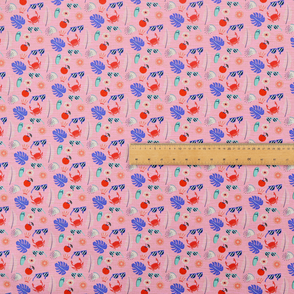 Pink summer-themed fabric featuring a repeating pattern of tropical icons including crabs, sunglasses, cherries, flip-flops, palm leaves, citrus slices, and flowers.