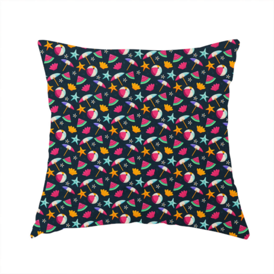 The fabric used to create this handmade cushion is a dark blue summer-themed fabric featuring a repeating pattern of tropical icons including beach balls, parasols, watermelon slices, starfish, seashells, and flowers.