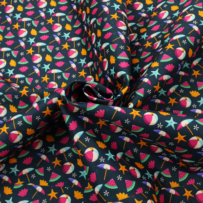 Dark blue summer-themed fabric featuring a repeating pattern of tropical icons including beach balls, parasols, watermelon slices, starfish, seashells, and flowers.