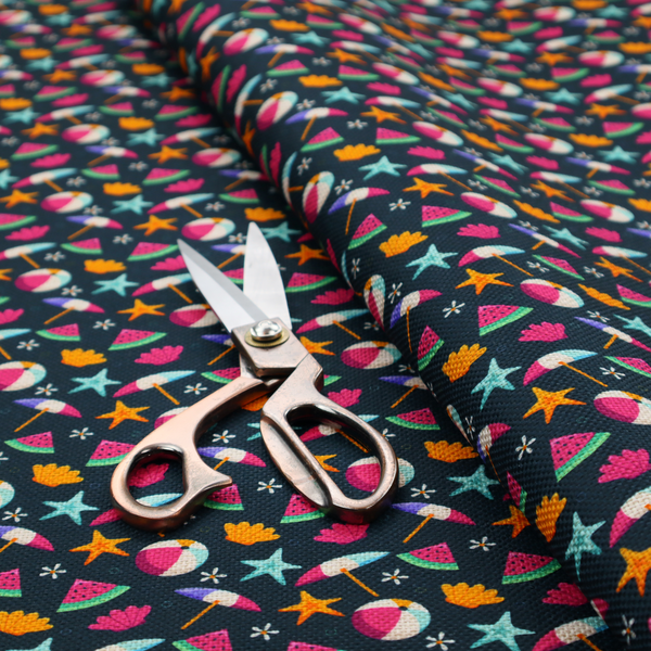 Dark blue summer-themed fabric featuring a repeating pattern of tropical icons including beach balls, parasols, watermelon slices, starfish, seashells, and flowers.