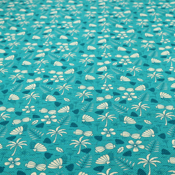 Teal summer-themed fabric featuring a repeating pattern of palm trees, seashells, flowers, and tropical foliage.