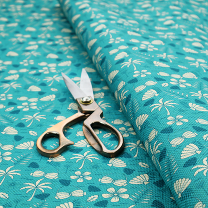 Teal summer-themed fabric featuring a repeating pattern of palm trees, seashells, flowers, and tropical foliage.
