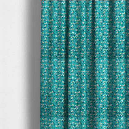 The fabric used to create these made-to-measure curtains is a teal summer-themed fabric featuring a repeating pattern of palm trees, seashells, flowers, and tropical foliage.