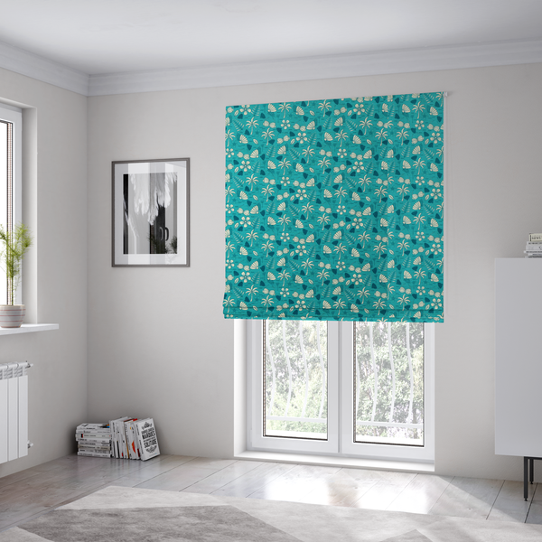 The fabric used to create these Roman blinds is a teal summer-themed fabric featuring a repeating pattern of palm trees, seashells, flowers, and tropical foliage.
