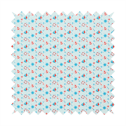 Light blue fabric featuring a small-scale repeating nautical pattern of red anchors, lifebuoys, and sailboats, interspersed with blue and red stars.