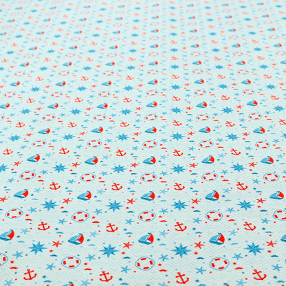 Light blue fabric featuring a small-scale repeating nautical pattern of red anchors, lifebuoys, and sailboats, interspersed with blue and red stars.