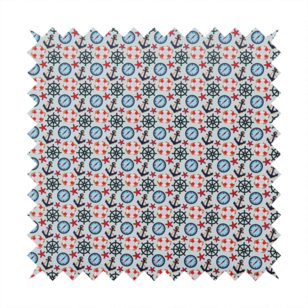 Light blue fabric with a dense repeating nautical pattern featuring dark blue anchors, black ship wheels, blue compasses, red-and-white lifebuoys, and tiny red stars.