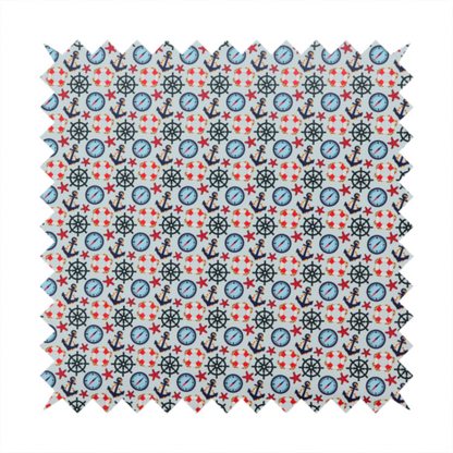 Light blue fabric with a dense repeating nautical pattern featuring dark blue anchors, black ship wheels, blue compasses, red-and-white lifebuoys, and tiny red stars.