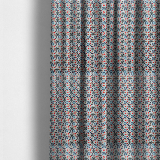 The fabric used to create these made-to-measure curtains is a light blue fabric with a dense repeating nautical pattern featuring dark blue anchors, black ship wheels, blue compasses, red-and-white lifebuoys, and tiny red stars.