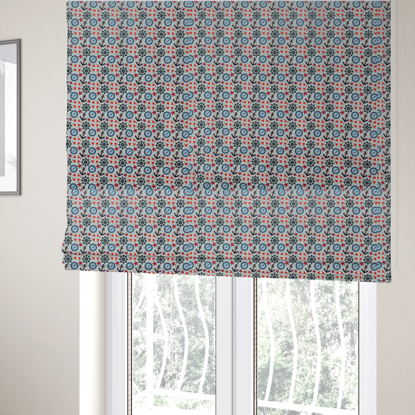 The fabric used to create these Roman blinds is a light blue fabric with a dense repeating nautical pattern featuring dark blue anchors, black ship wheels, blue compasses, red-and-white lifebuoys, and tiny red stars.
