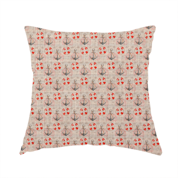 The fabric used to create this handmade cushion is a nautical-themed repeating pattern featuring anchors and life rings over a woven, textured beige background.