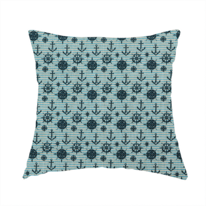 The fabric used to create this handmade cushion is a nautical-themed repeating pattern featuring dark blue anchors, ship wheels, compass roses, and stars over a light blue and dark blue striped background.