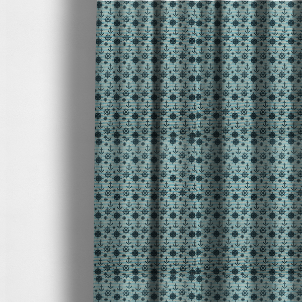 The fabric used to create these made-to-measure curtains is a nautical-themed repeating pattern featuring dark blue anchors, ship wheels, compass roses, and stars over a light blue and dark blue striped background.
