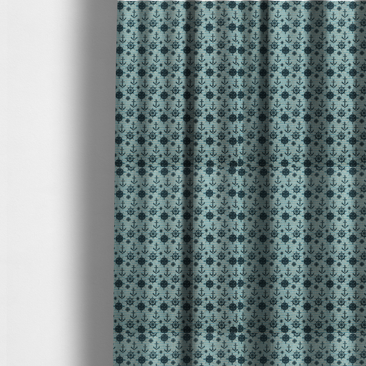 The fabric used to create these made-to-measure curtains is a nautical-themed repeating pattern featuring dark blue anchors, ship wheels, compass roses, and stars over a light blue and dark blue striped background.