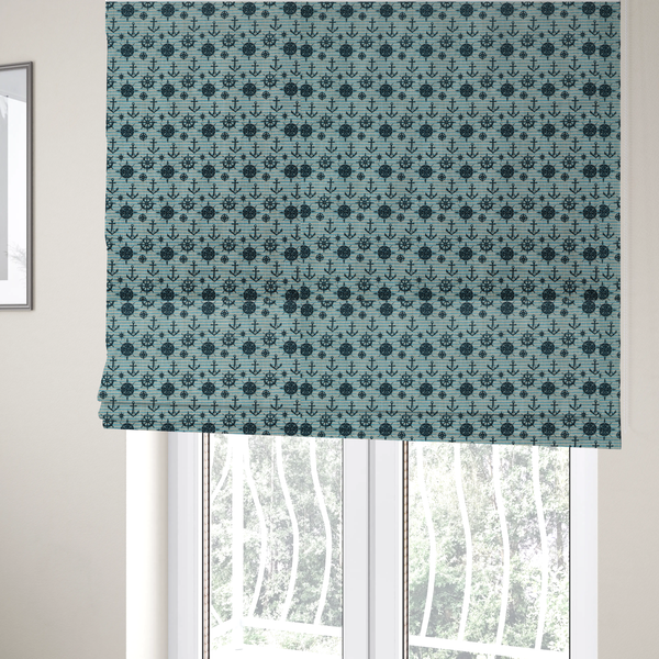 The fabric used to create these Roman blinds is a nautical-themed repeating pattern featuring dark blue anchors, ship wheels, compass roses, and stars over a light blue and dark blue striped background.