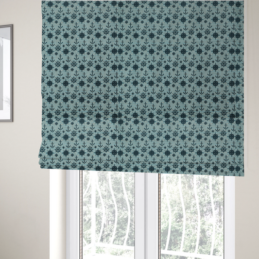 The fabric used to create these Roman blinds is a nautical-themed repeating pattern featuring dark blue anchors, ship wheels, compass roses, and stars over a light blue and dark blue striped background.