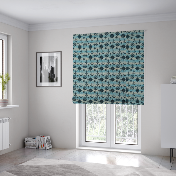 The fabric used to create these Roman blinds is a nautical-themed repeating pattern featuring dark blue anchors, ship wheels, compass roses, and stars over a light blue and dark blue striped background.