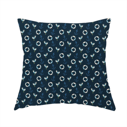 The fabric used to create this handmade cushion is a nautical-themed repeating pattern featuring seagulls, anchors, and life rings set against a dark blue background.