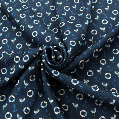 Nautical-themed repeating pattern featuring seagulls, anchors, and life rings set against a dark blue background.