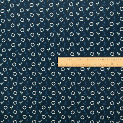 Nautical-themed repeating pattern featuring seagulls, anchors, and life rings set against a dark blue background.