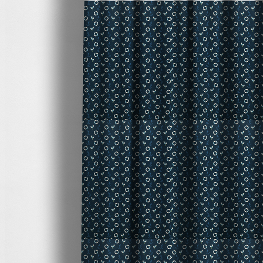 The fabric used to create these made-to-measure curtains is a nautical-themed repeating pattern featuring seagulls, anchors, and life rings set against a dark blue background.