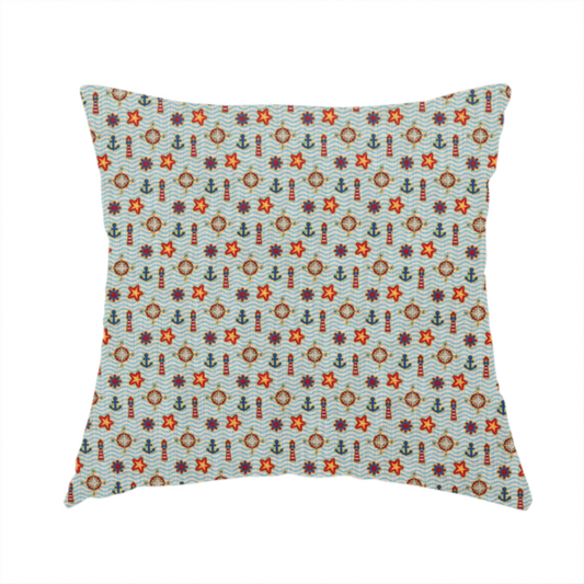 The fabric used to create this handmade cushion is a nautical-themed repeating pattern featuring lighthouses, anchors, compass stars, and starfish over a wavy-lined background.