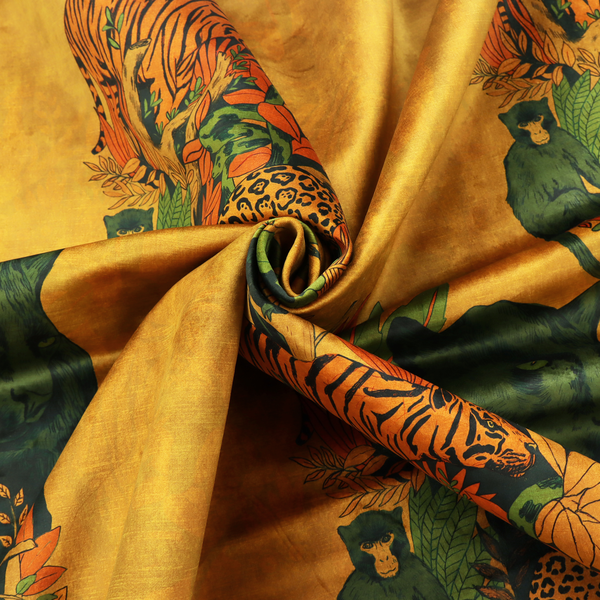 Mustard yellow fabric featuring a repeating jungle panel design with green panthers, tigers, leopards, monkeys, toucans, and lush tropical foliage.